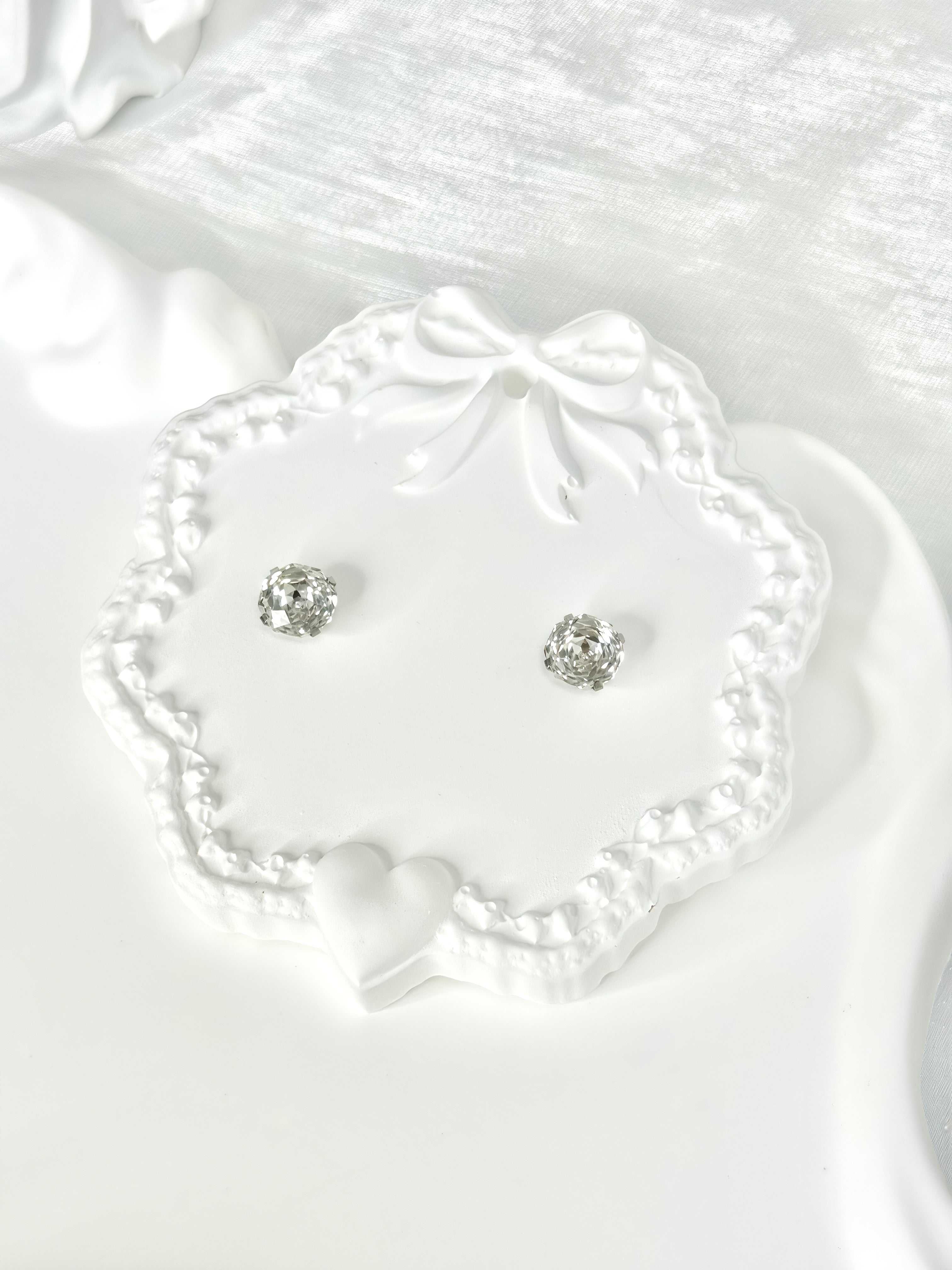 Shiny White Titanium Steel Millennium Cut Rose Pattern Earrings