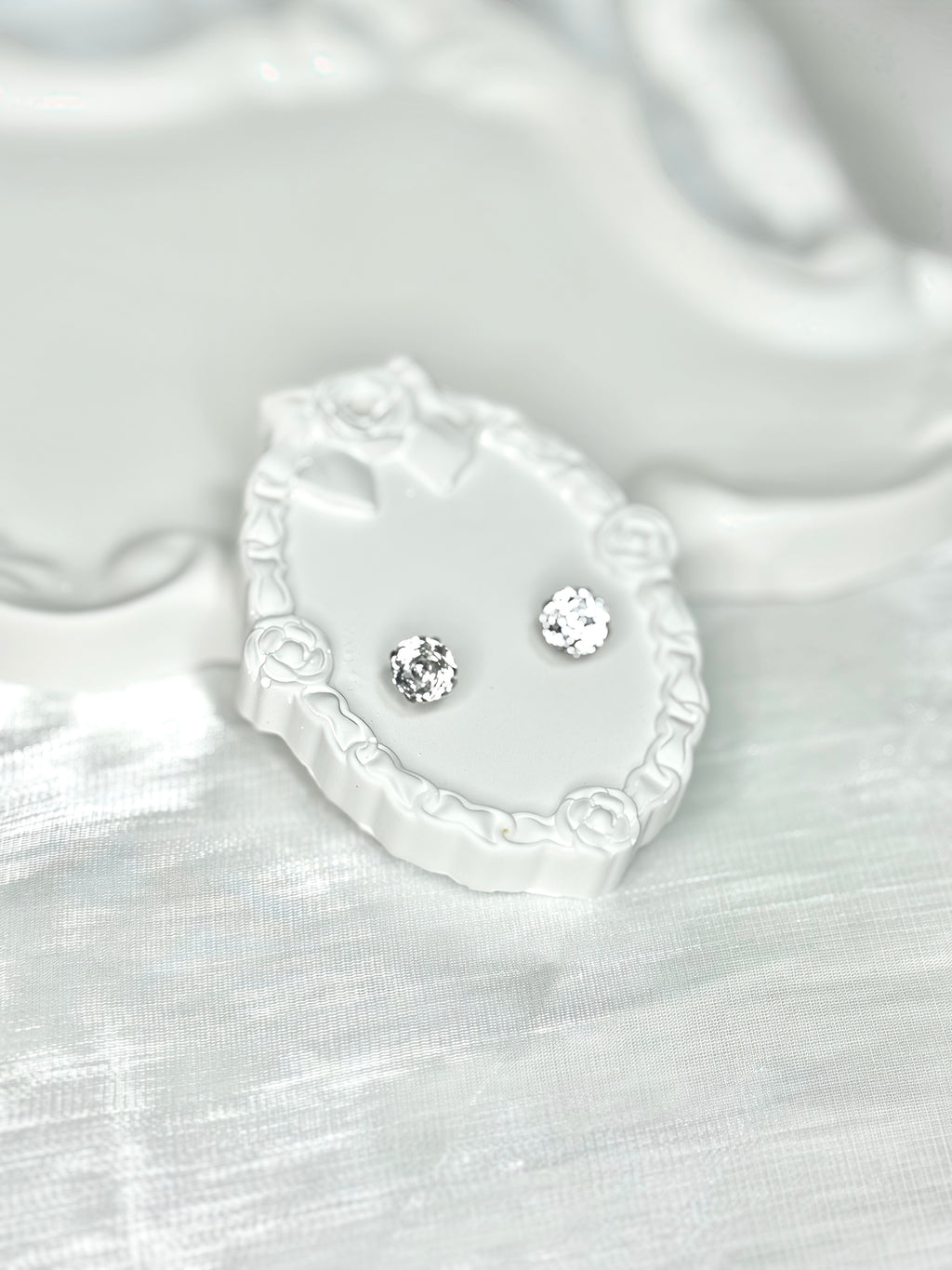 Shiny White Titanium Steel Millennium Cut Rose Pattern Earrings