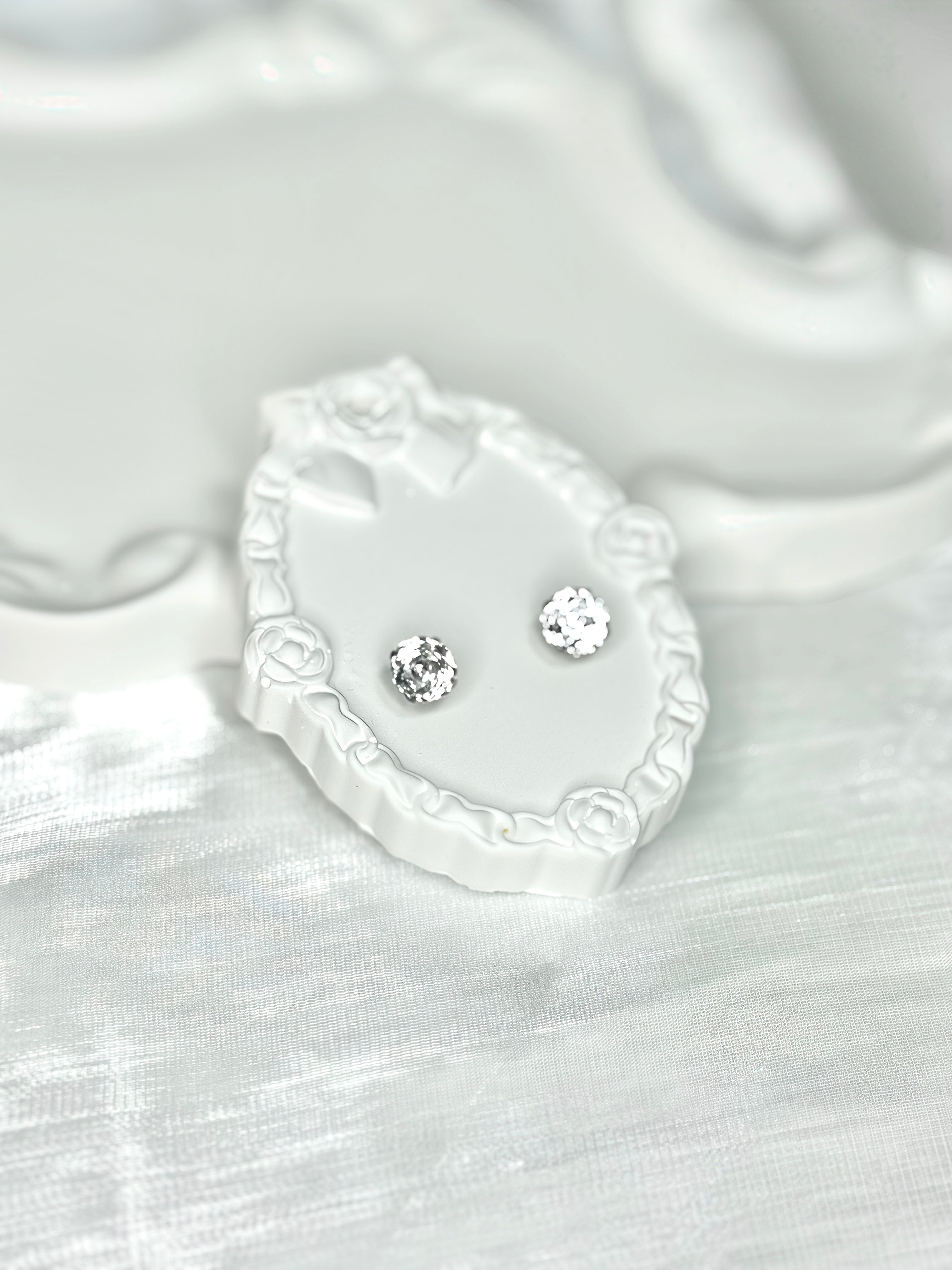 Shiny White Titanium Steel Millennium Cut Rose Pattern Earrings
